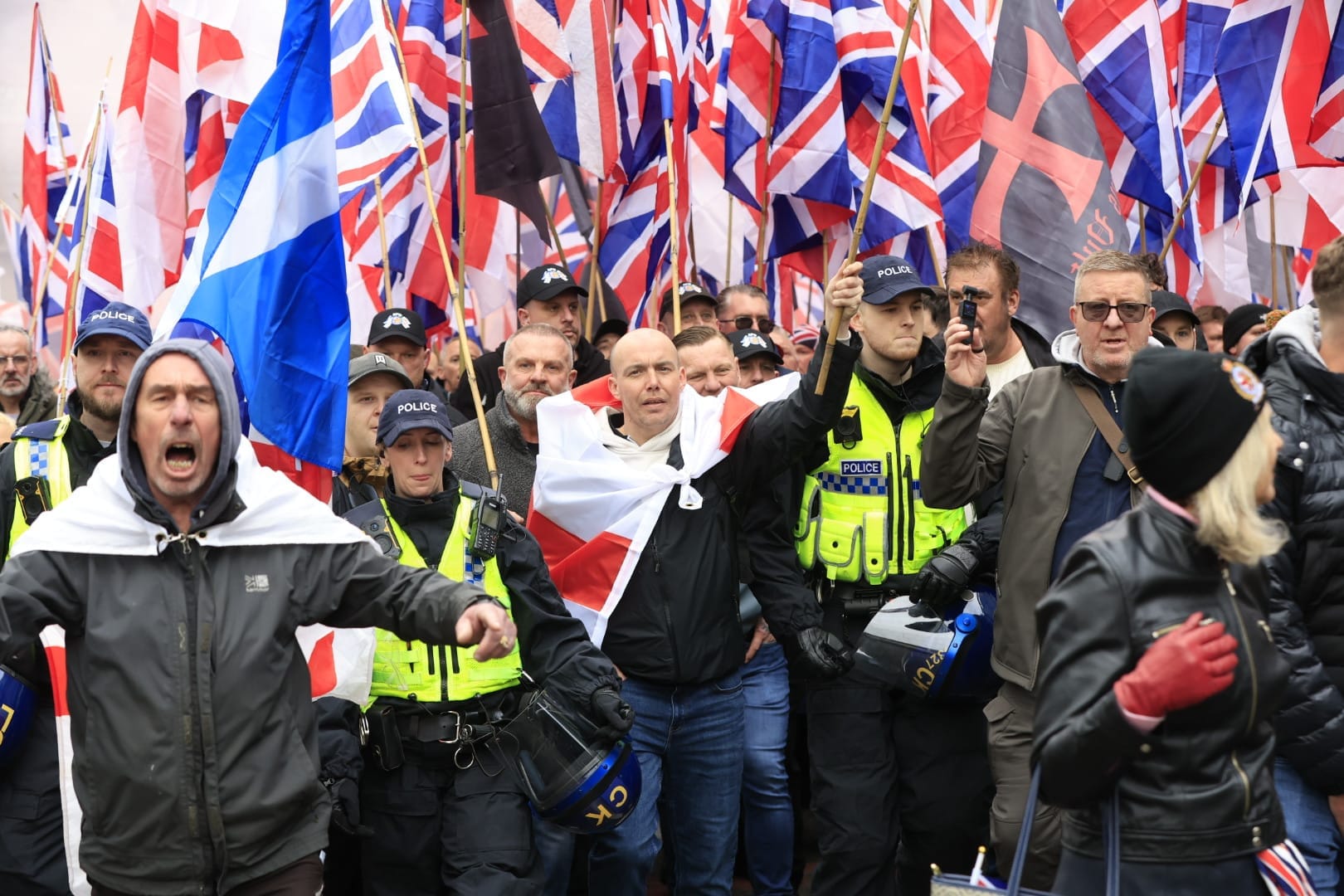 ‘Go back to where you came from’: 11 arrests as far-right descend on Manchester