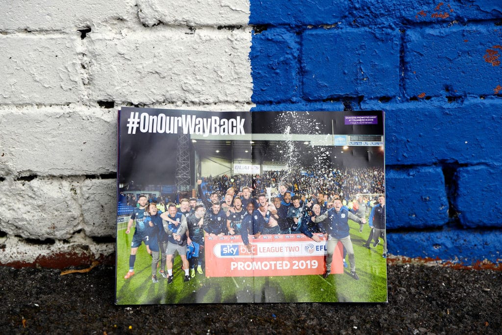 A matchday programme at Gigg Lane. Photo: Charlotte Tattersall via Getty.