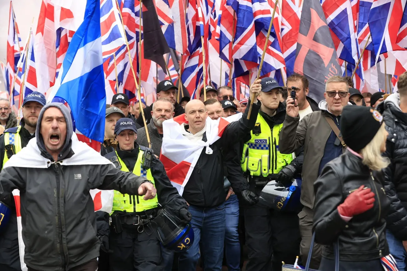 ‘Go back to where you came from’: 11 arrests as far-right descend on Manchester